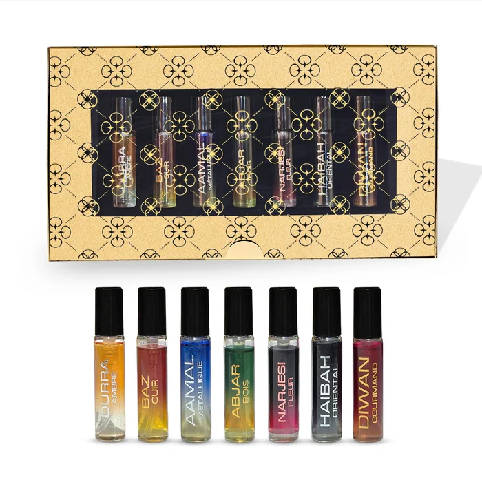 A gift box of seven small perfume oil bottles in different colours, with the bottles laid out below