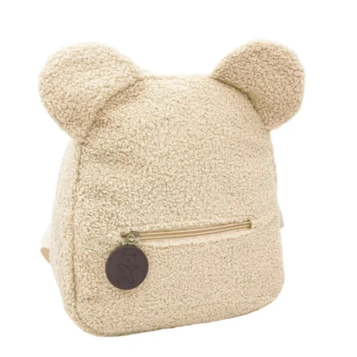 A cream teddy fleece backpack with round bear ears