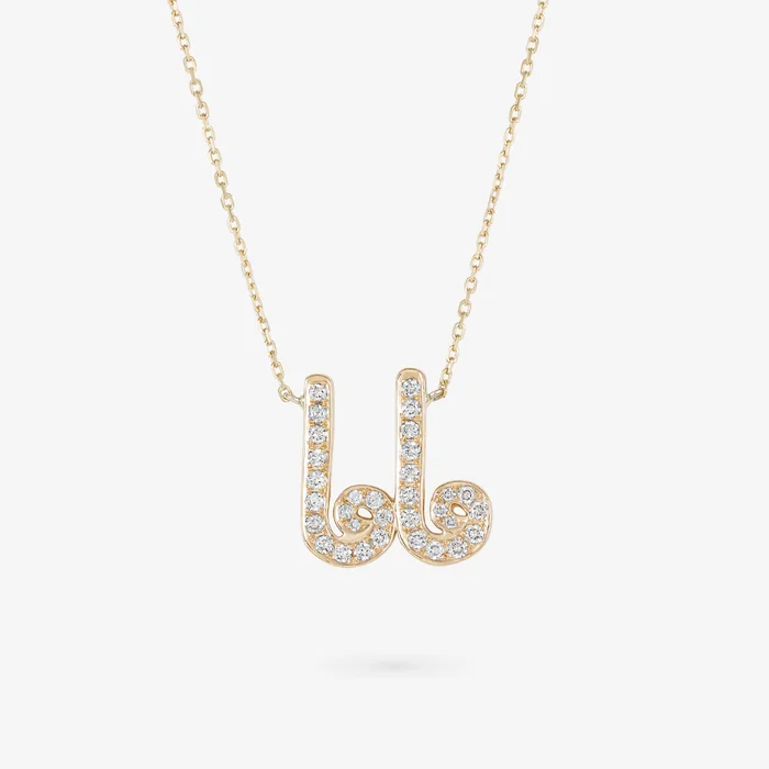 A gold necklace with a pendant spelling Mama in Arabic letters set with white stones
