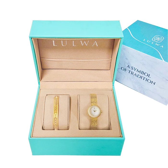 An open turquoise Lulwa gift box holding a slim gold bangle and a gold watch with a mother of pearl dial