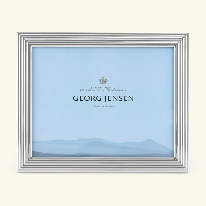 A silver Georg Jensen picture frame with ridged edges