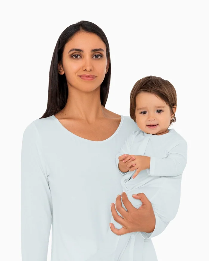A mother and baby in matching pale blue loungewear