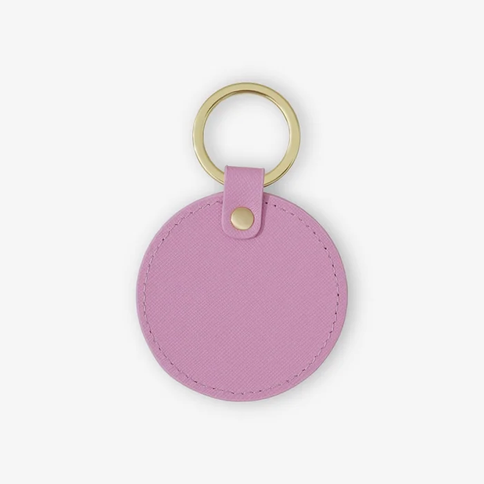 A round lilac leather keyring with a gold ring